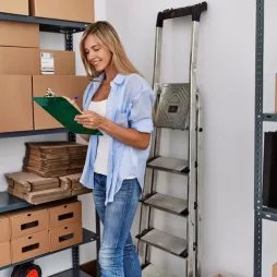 Young,Blonde,Woman,Ecommerce,Business,Worker,Writing,On,Clipboard,At